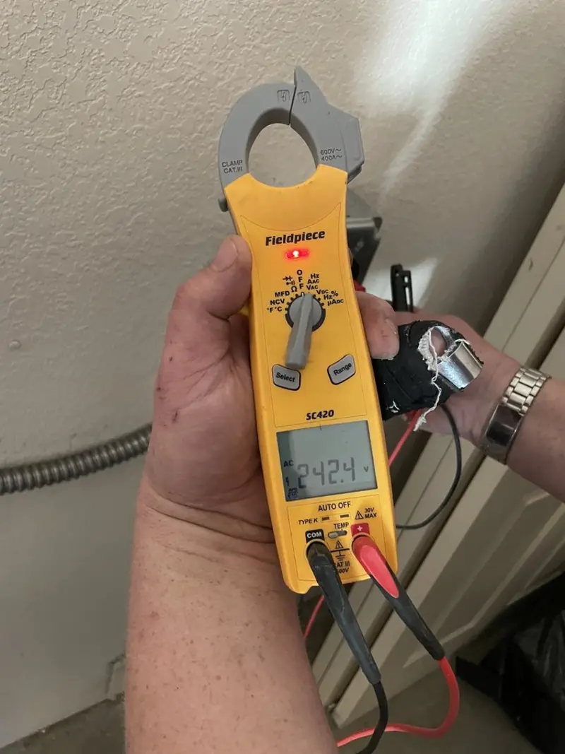 Voltage testing with clamp meter during Electrical Installation Services in Carmel